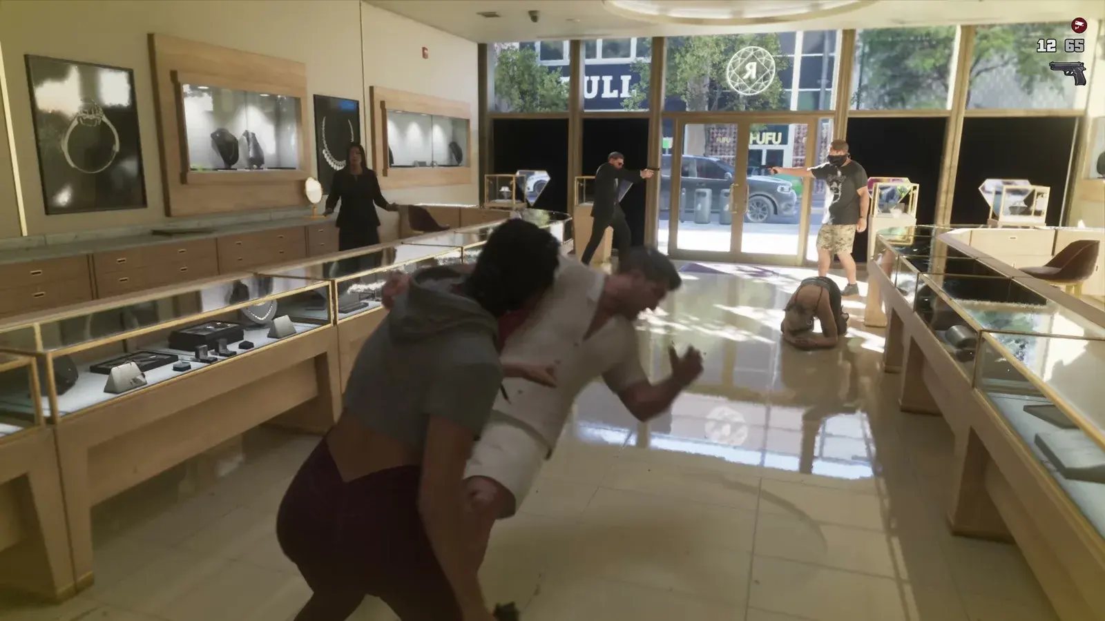 Masked robbers inside a jewelry store with customers lying on the floor beside glass display cases