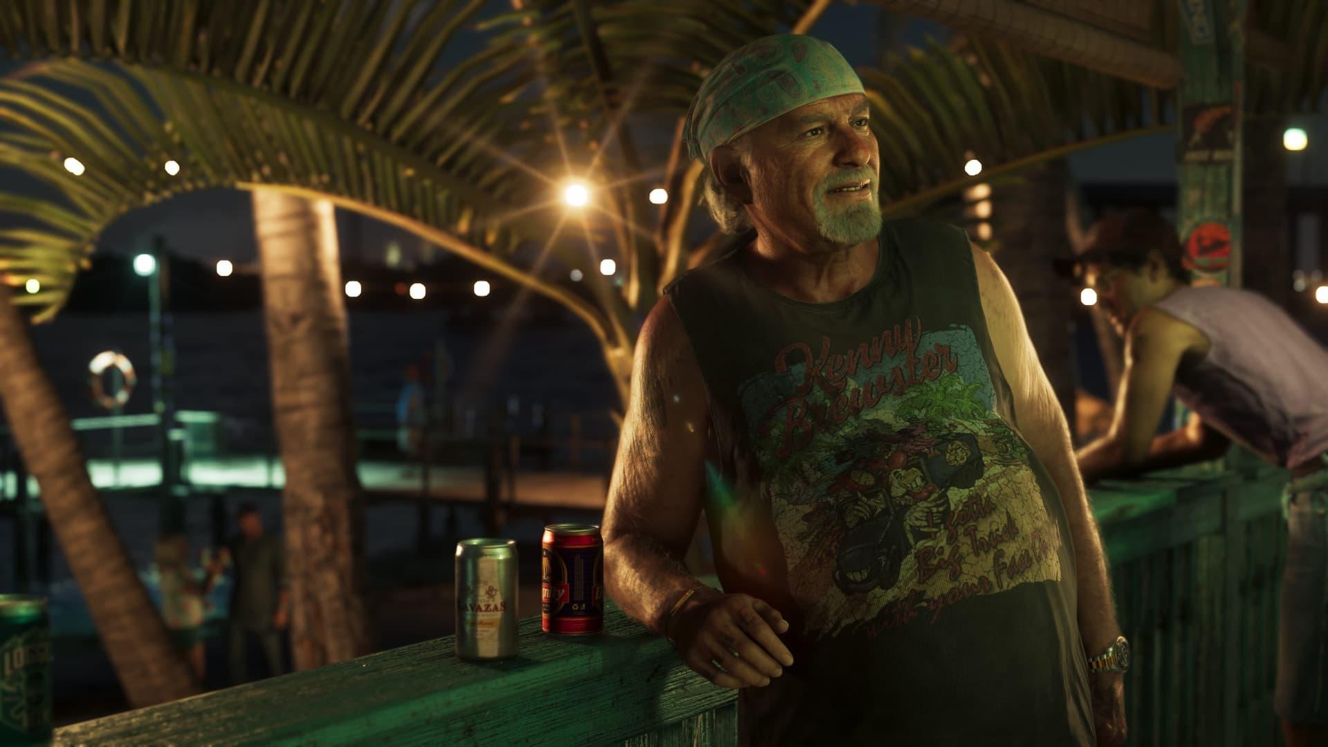 Brian Heder in a bandana and sleeveless shirt leaning on a railing with two cans, palms and string lights behind him