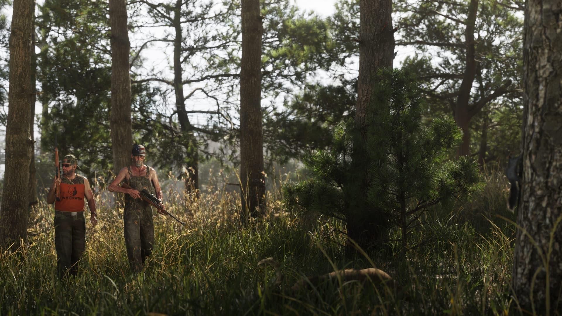 Two people carrying rifles walking through tall grass between pine trunks