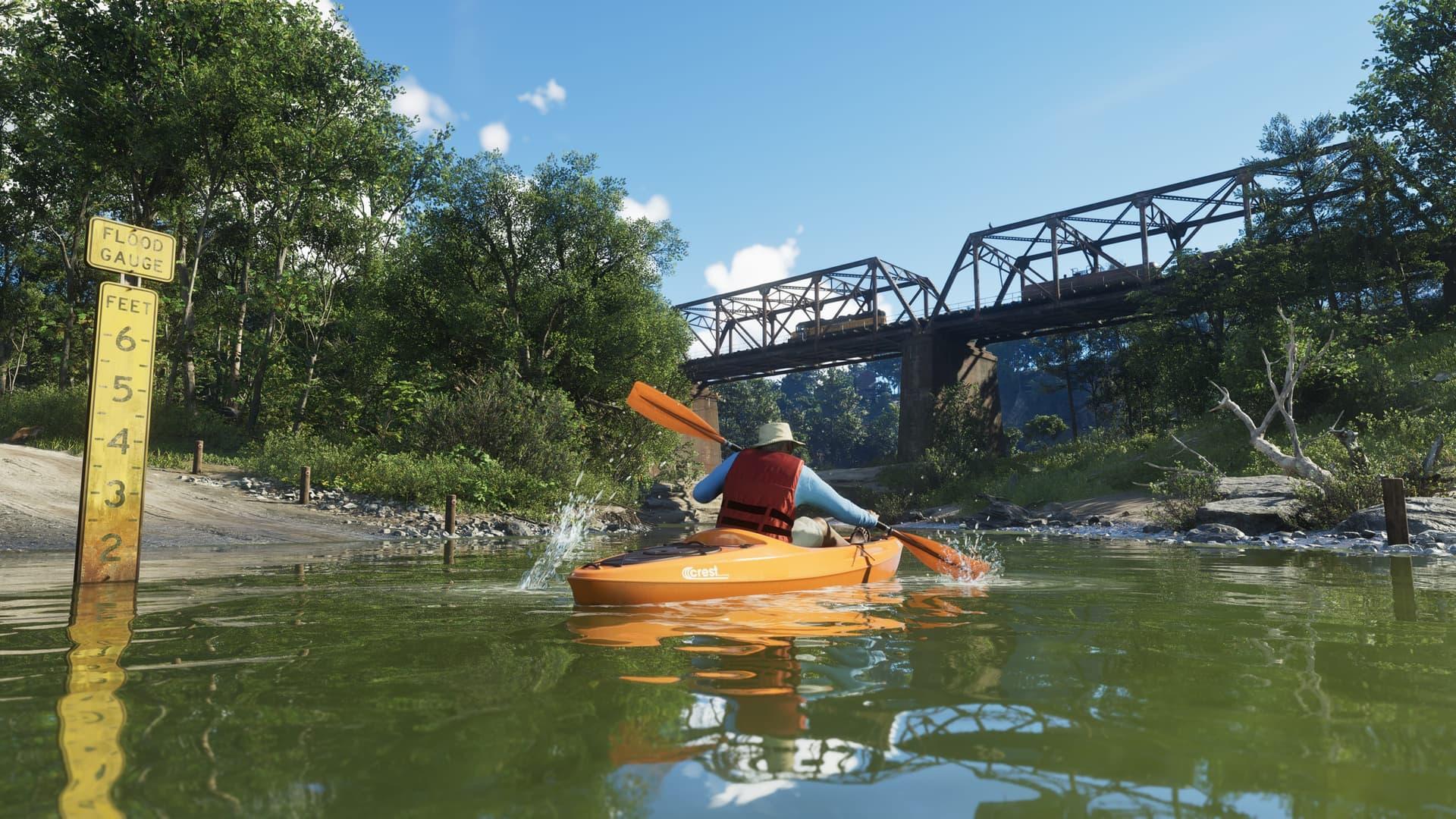 A person in a life vest paddling a yellow kayak toward a bridge