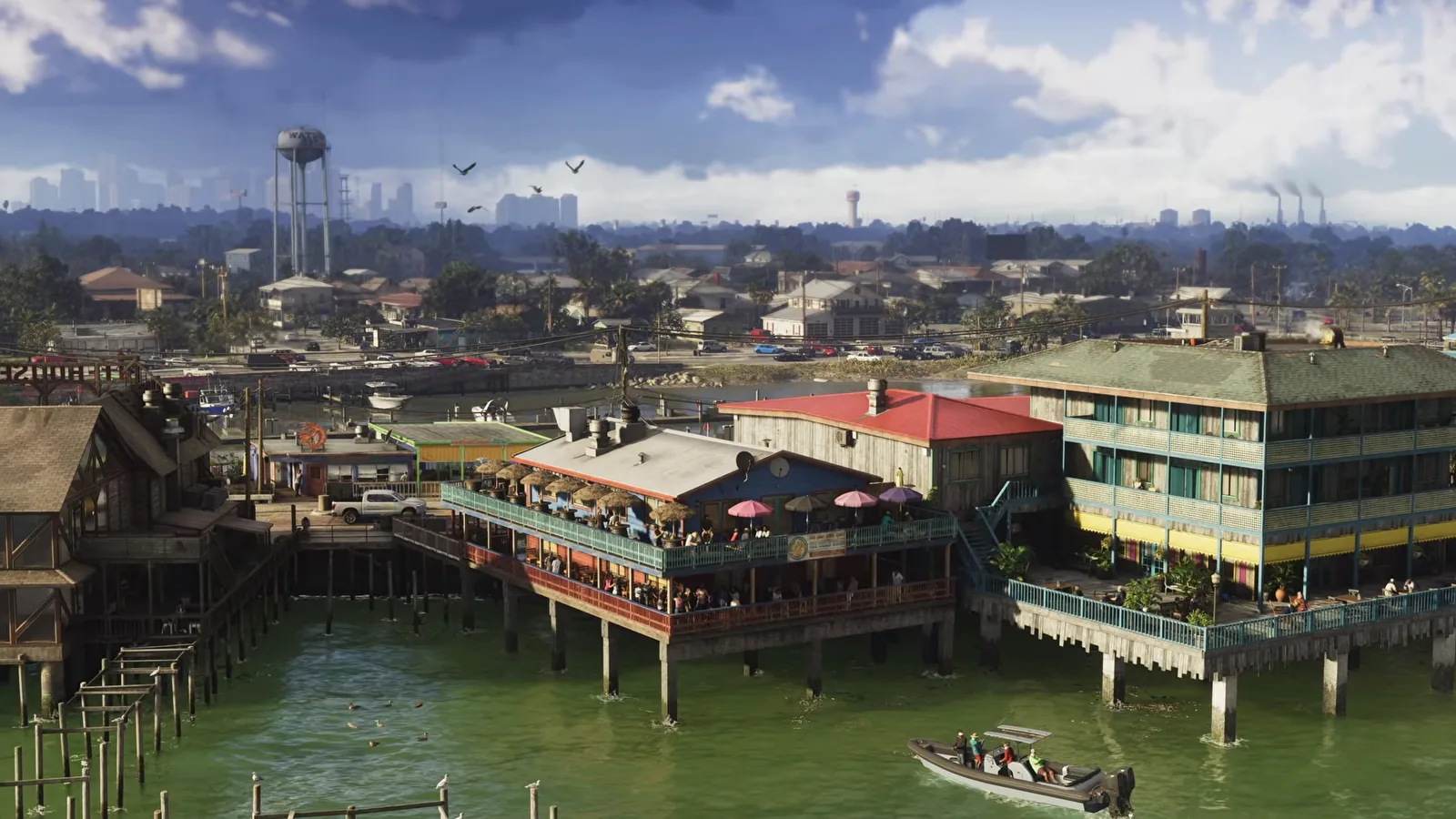Aerial view of Watson Bay, a stilted waterfront town of restaurants and a motel in GTA 6, with the Vice City skyline visible in the distance