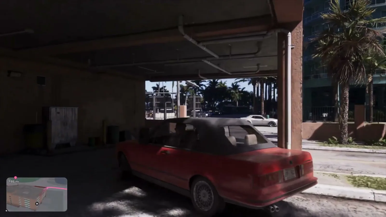 GTA 6 red convertible parked in a Vice City parking garage during the Extended Look trailer