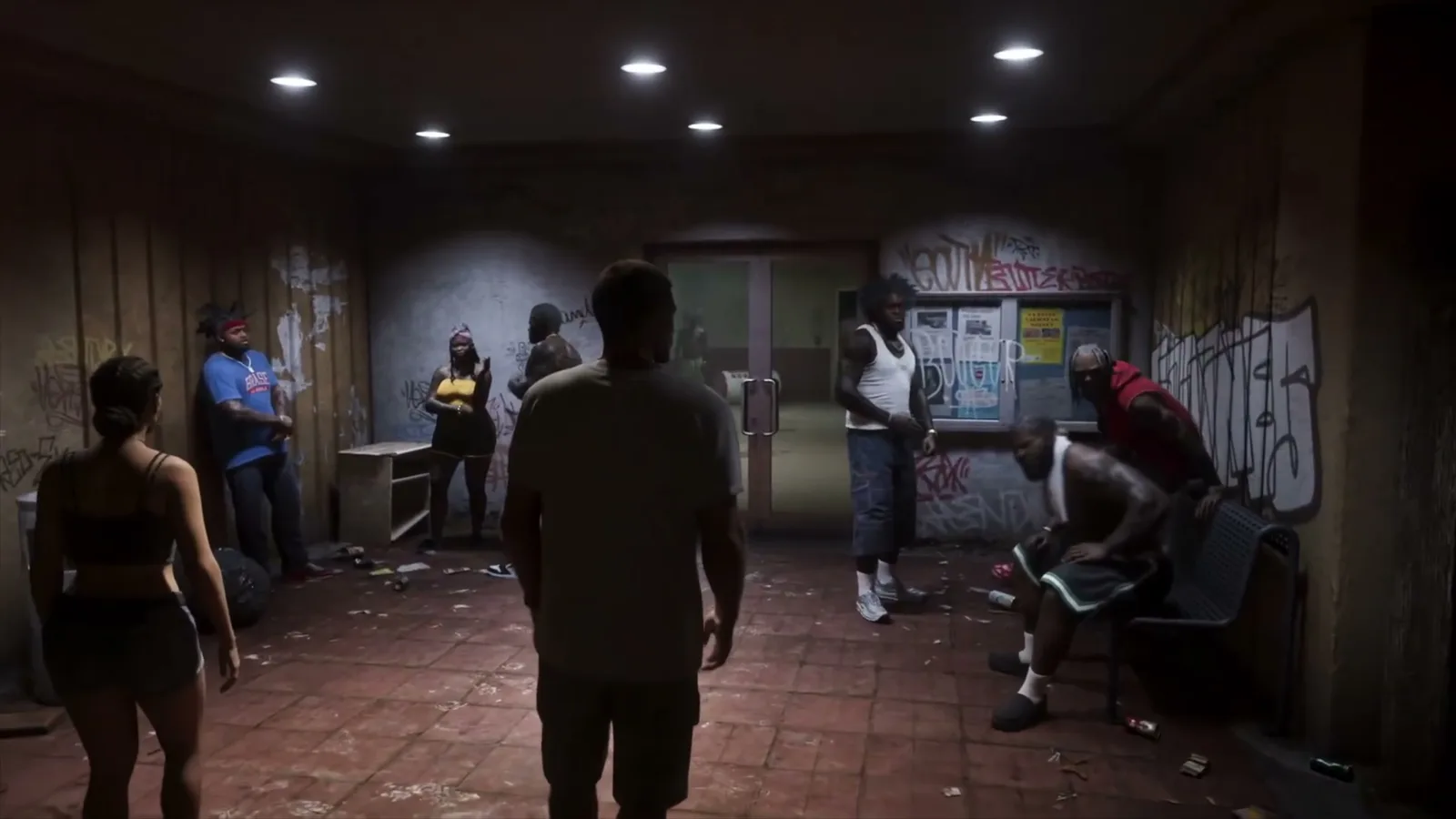 GTA 6 group confrontation with multiple NPCs inside a graffiti-covered room in the Extended Look trailer