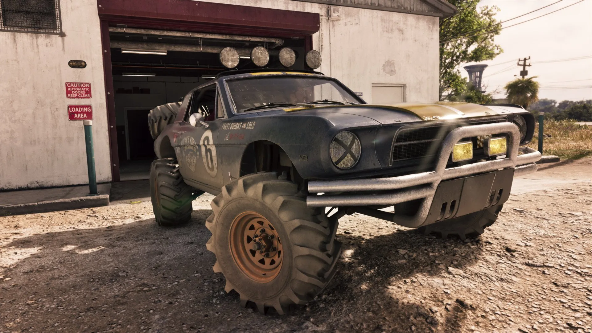 The '67 Vapid Dominator Buggy parked outside a workshop in GTA 6, showing its oversized off-road tires and roof lights